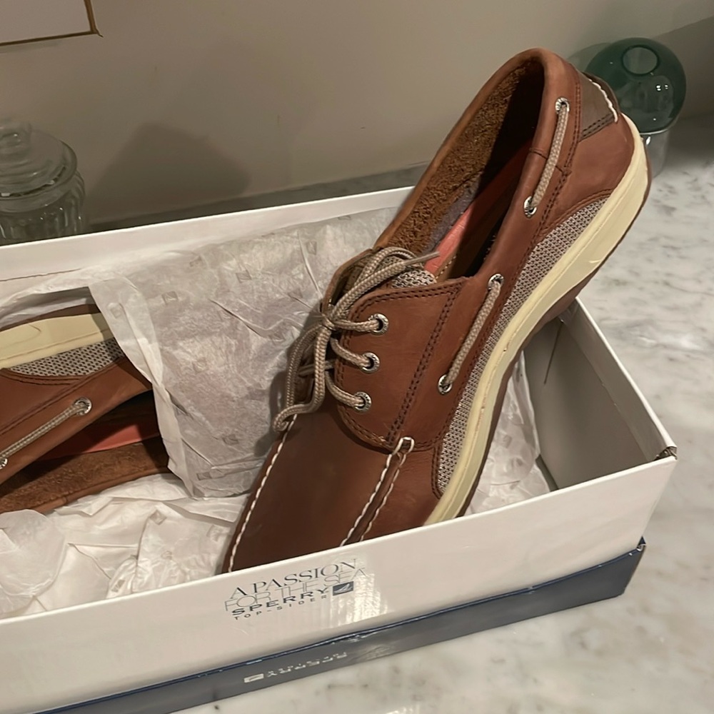 Sorry Topsider brand new in box.  Mens size 13style 3369